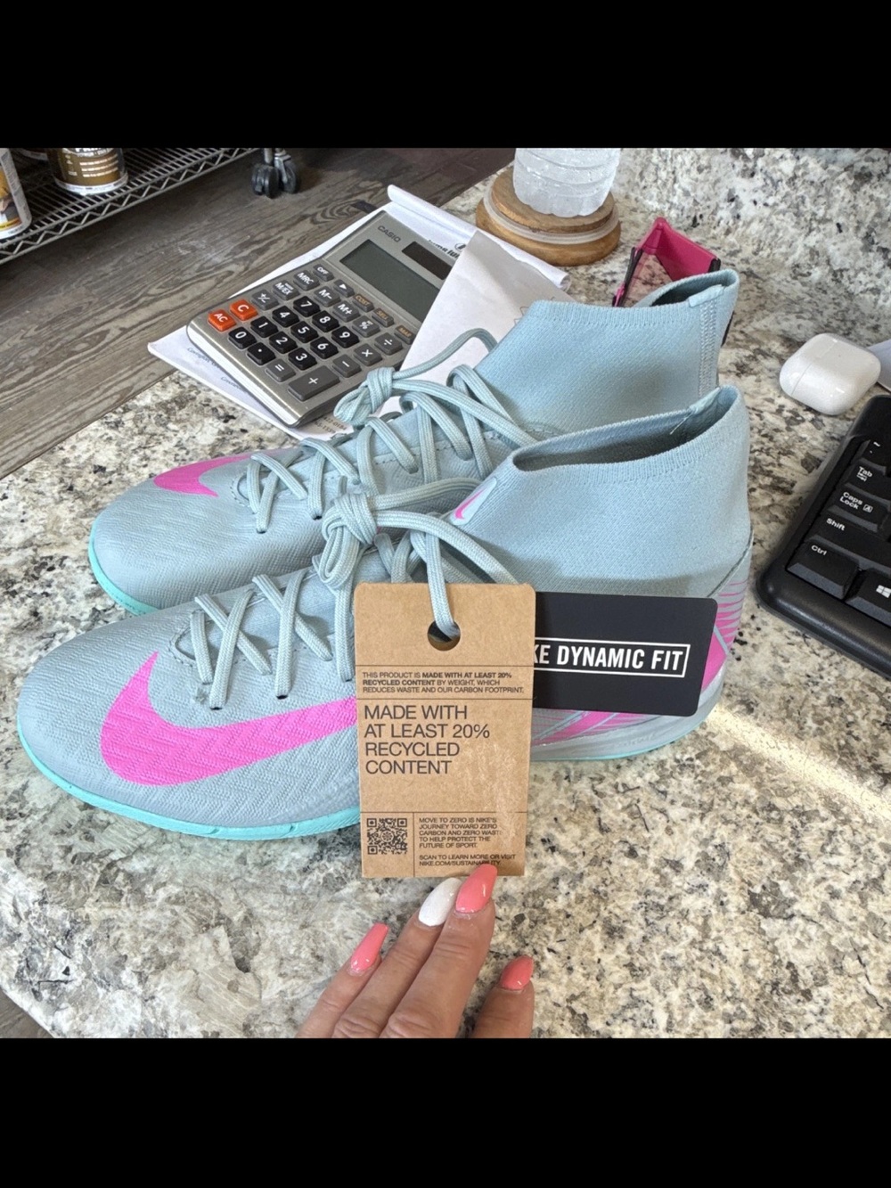 Nike Women's Light Blue Soccer Shoes with Pink Swoosh